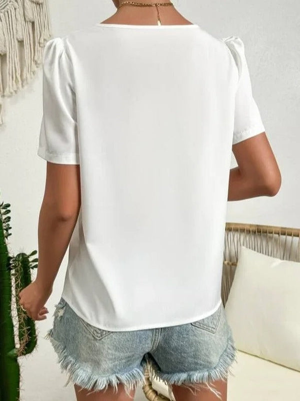 Weiße asymmetrische Bluse mit Puffärmeln und Kragen