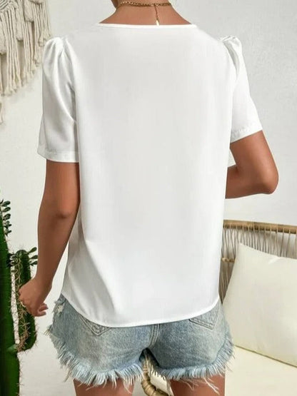Weiße asymmetrische Bluse mit Puffärmeln und Kragen
