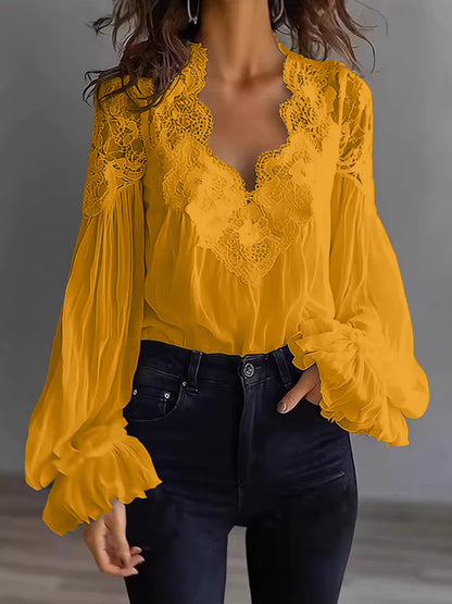 Damenbluse mit Spitzenpatchwork und Puffärmeln